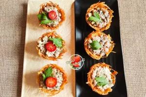 Закуска грибная и закуска селёдочная в картофельных корзиночках